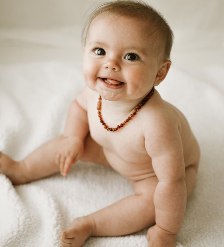 a baby sitting about 6 months old, taken in a natural light studio in Adelaide Hills