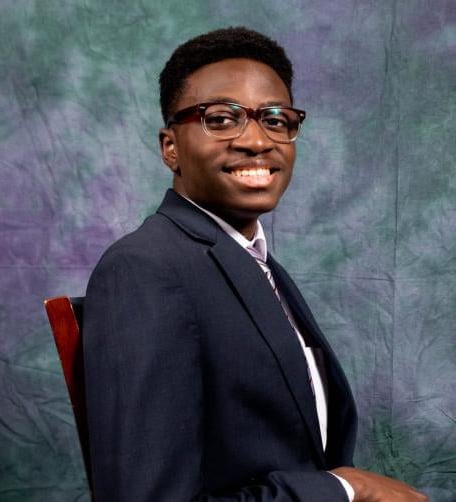 Tayo Alalade In a suit for Tilver