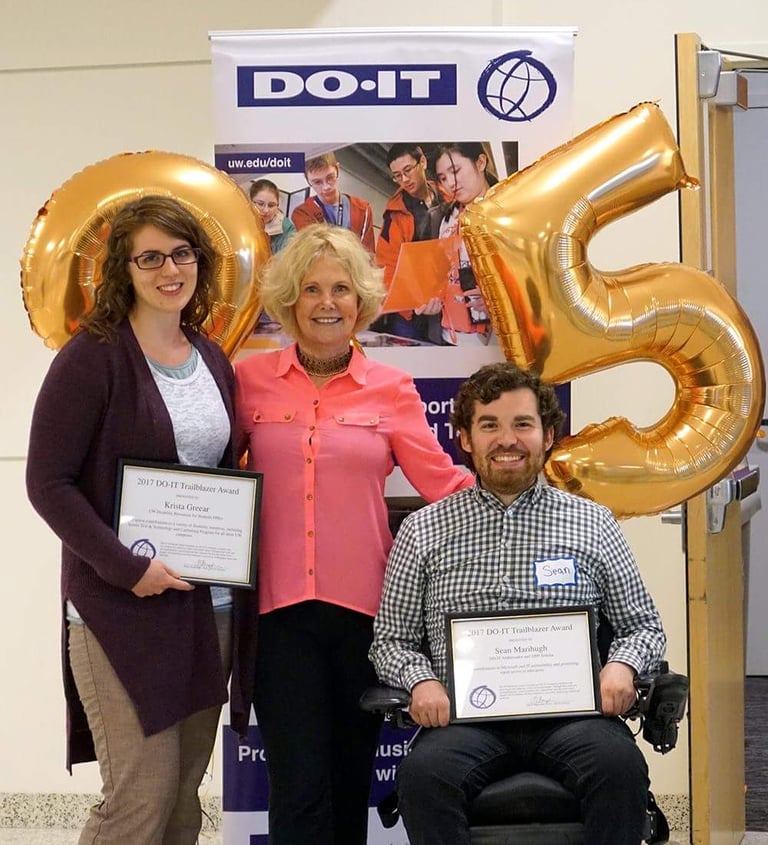 Sean with director of DO-IT and Krista Greerar, both holding a framed 2015 Trailblazer award