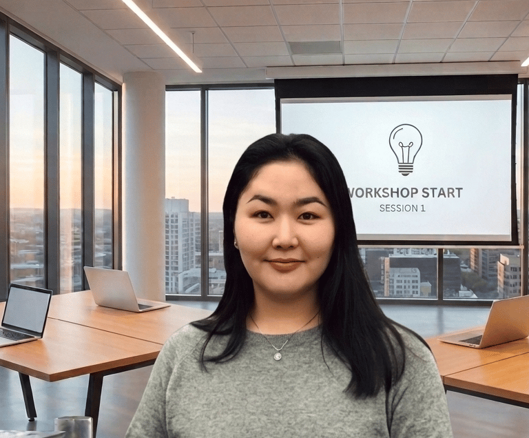 Professional woman at a corporate business workshop session in a modern office setting.