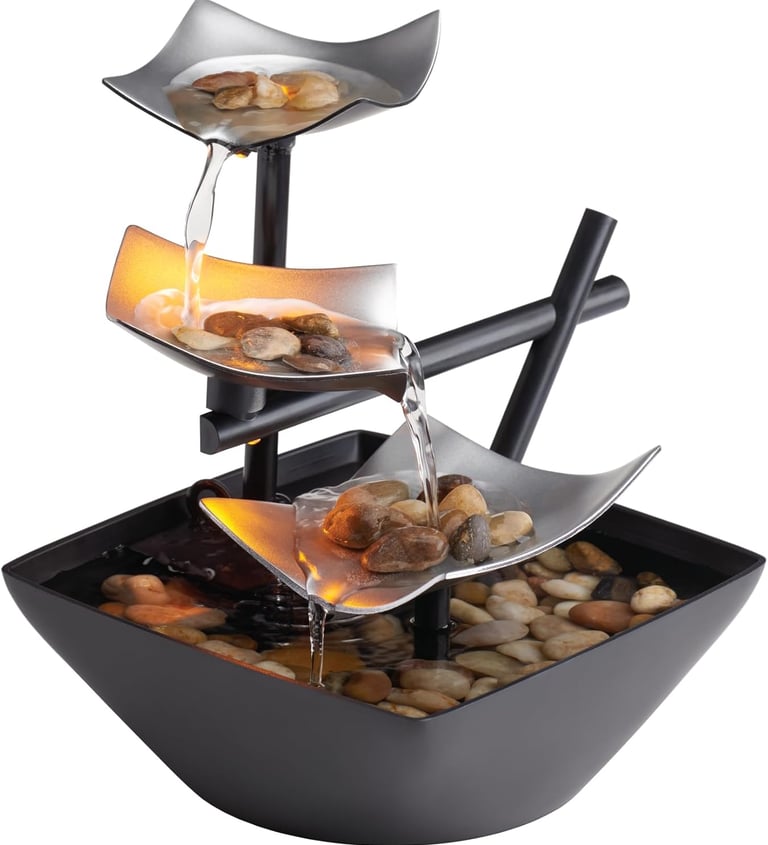 Indoor tabletop water fountain with cascading water, natural river rocks and LED lights for calming home or office decor