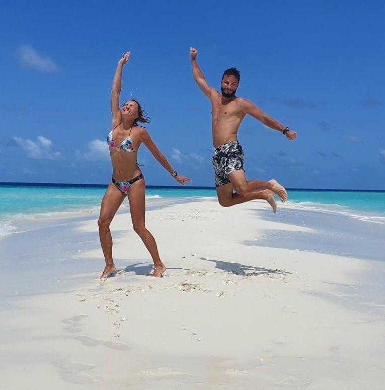 a man and woman jumping in the air