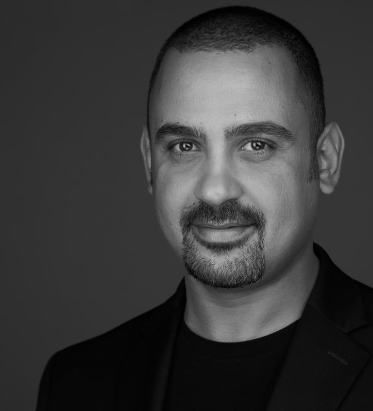 black and white headshot photo of hamza rouissi