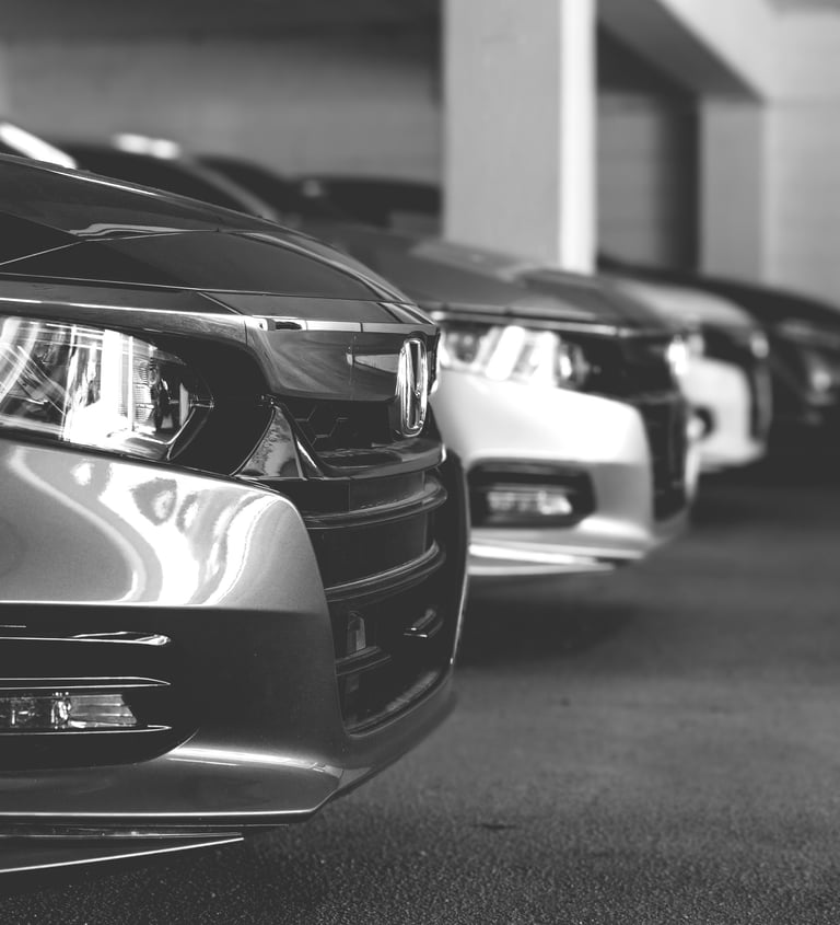 a row of parked cars in a parking lot