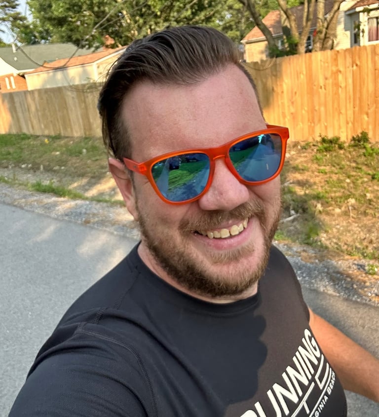 a man in sunglasses and sunglasses taking a selfie