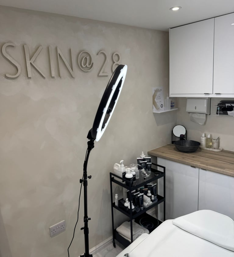 inside of beauty clinic showing clean boutique space and Skin @ 28 sign
