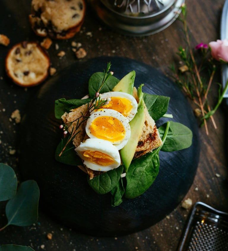 Healthy balanced meal with eggs avocado and greens nutritious food