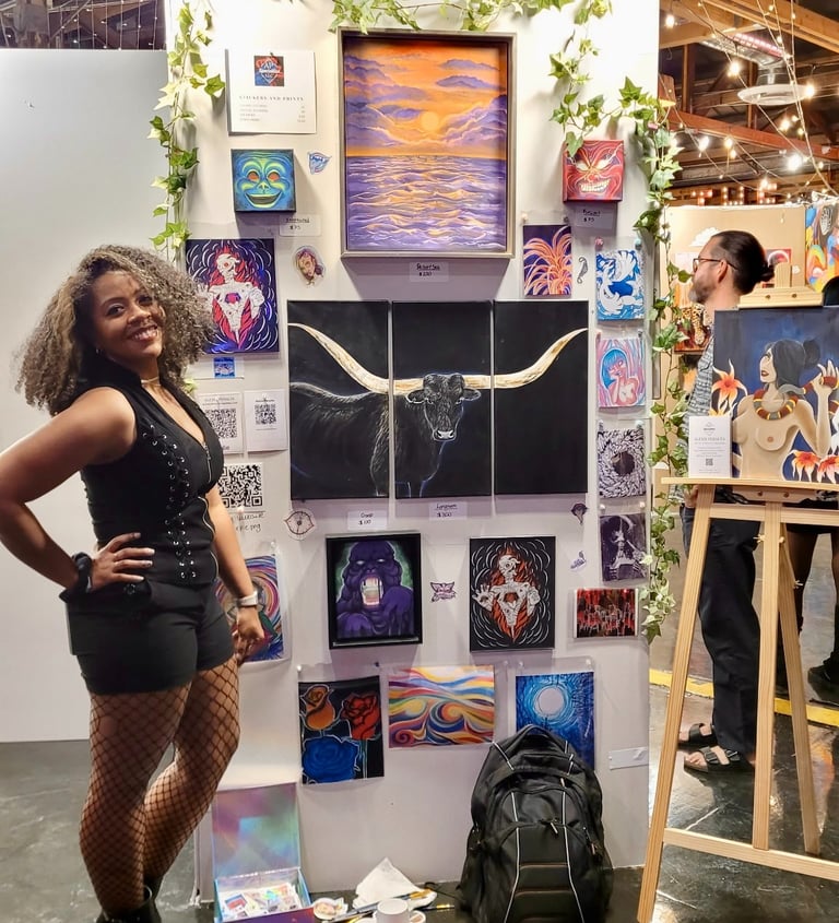 Alexis Peralta the artist standing in front of her wall of art at a gallery pancakes and booze