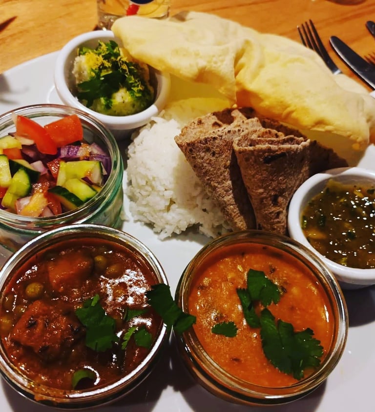 A thali plate full of indian food from a curry night at the ark northampton