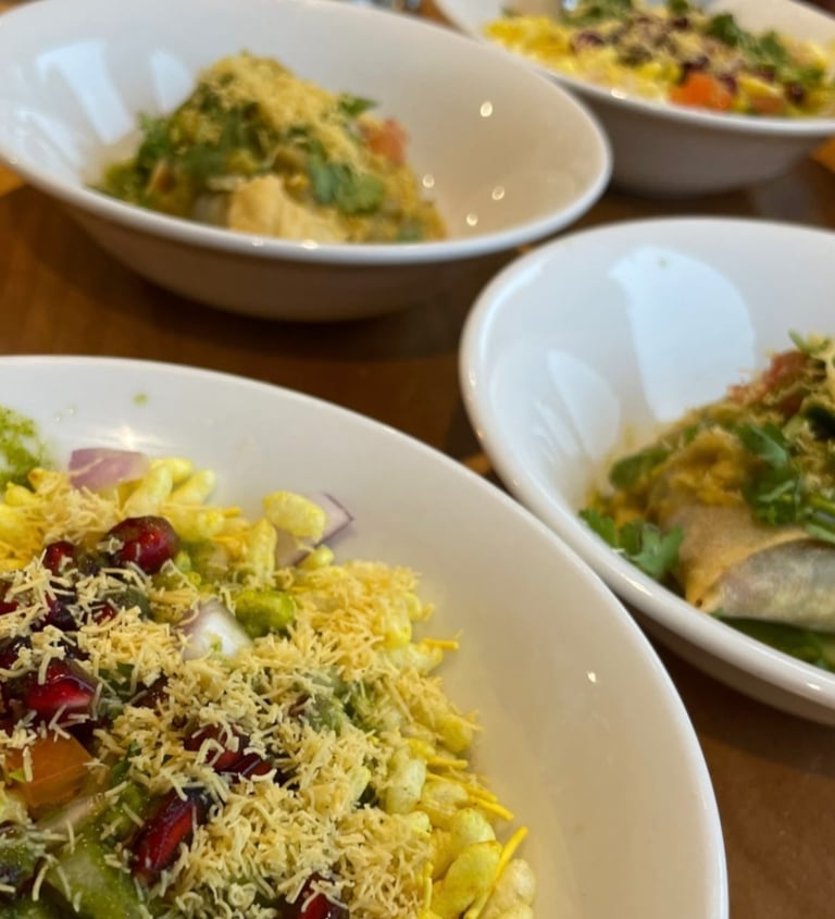 Three bowls of Indian food at a curry night at the ark northampton