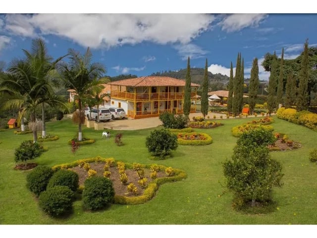 a large house with a car parked in front of it