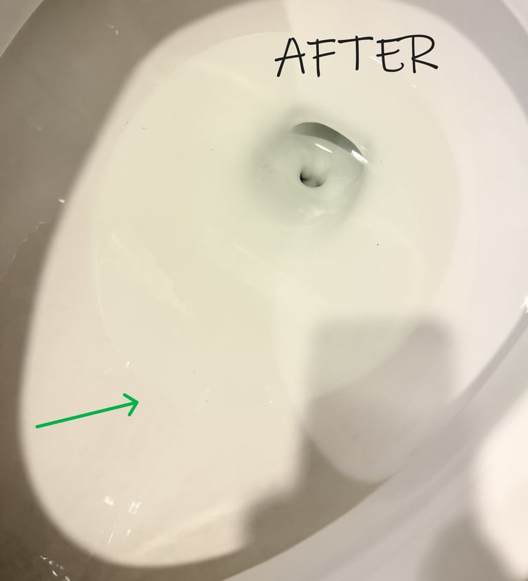 Toilet bowl clean and bright with a green arrow showing where the ring used to be