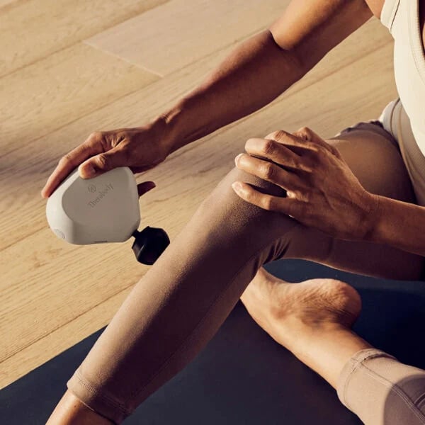 Compact Theragun Mini massage gun with an ergonomic design for targeted muscle relief