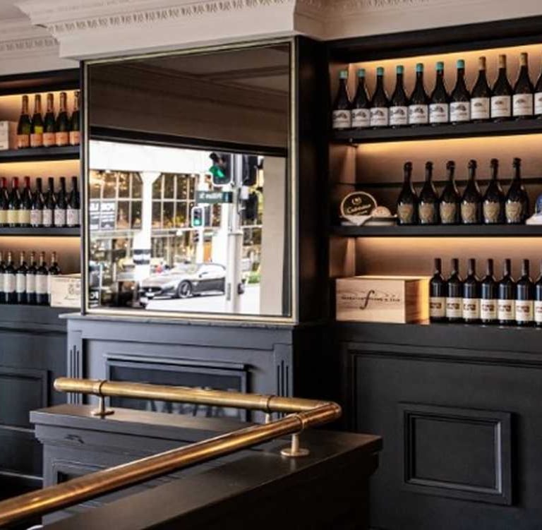 a bar with a bar counter and a bar with a bar stool