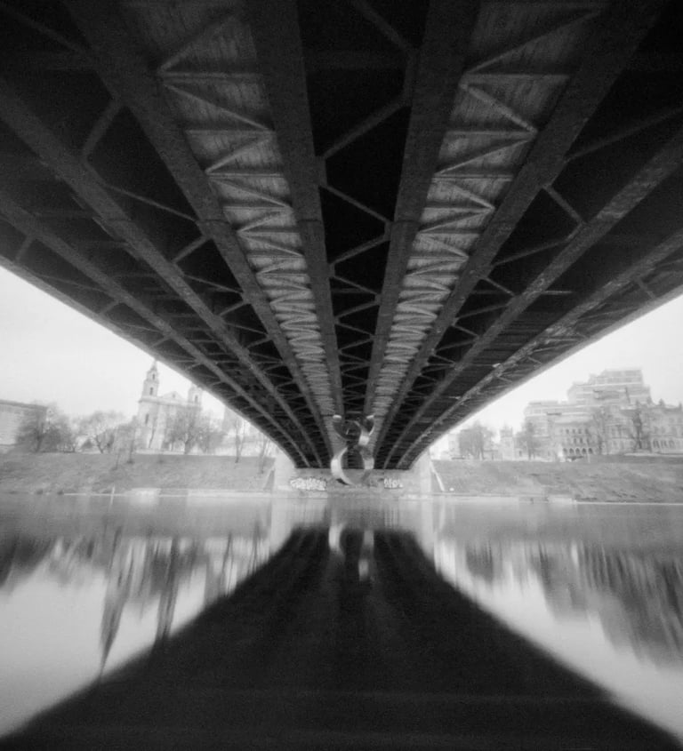 River crossing with black and white bridge