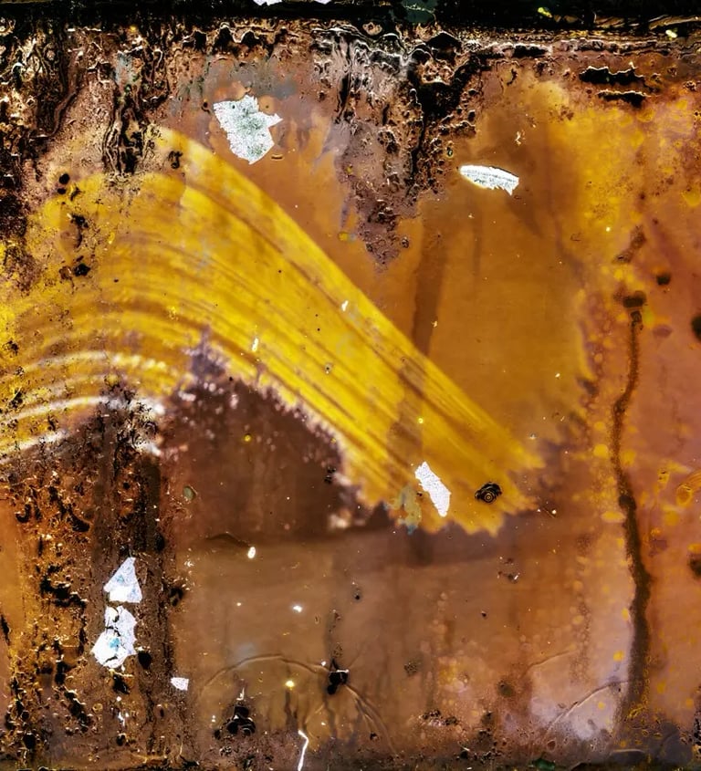 Rusty photopaper with yellow photo, weathered by sun exposure over six months