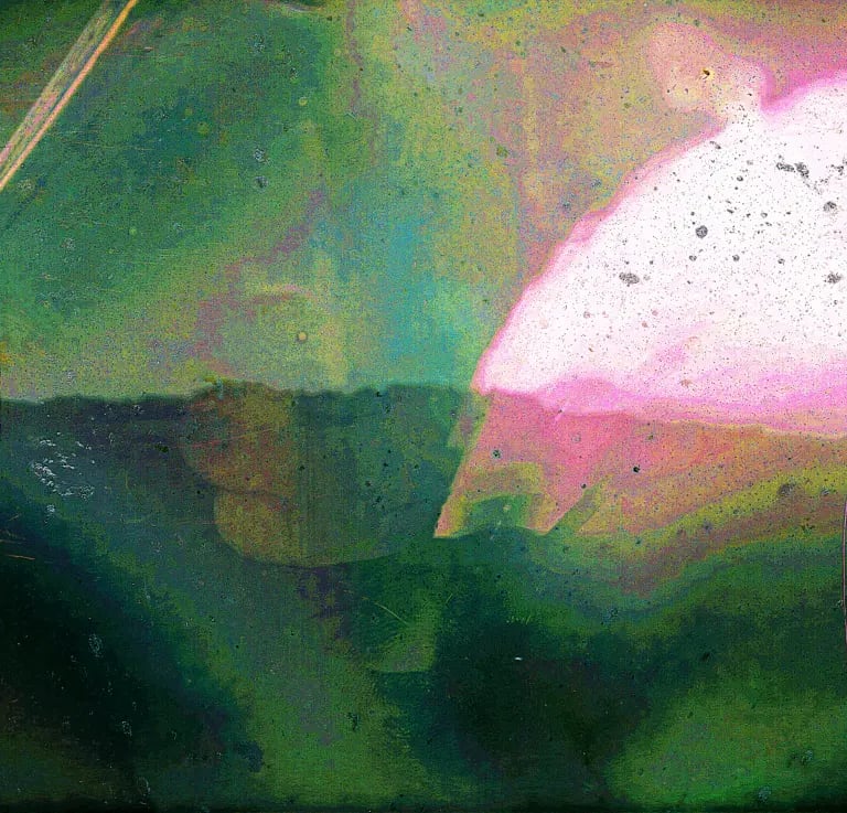 Abstract photograph of sun path in green and purple