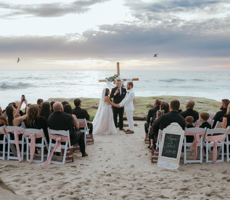 wedding Ceremony on the sand at Windansea Beach la jolla, with cross altar