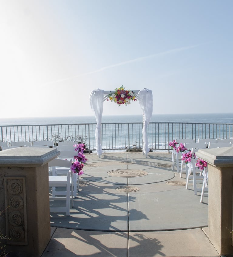 wedding set up with white arch at moonlight beach overlook, encinitas