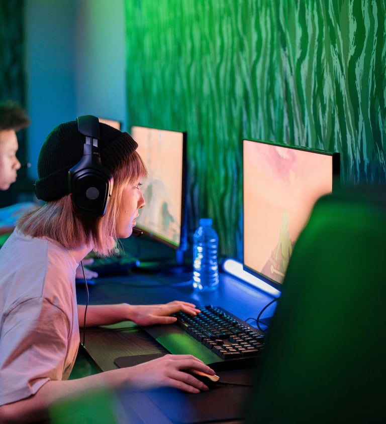 A woman on a PC playing a videogame