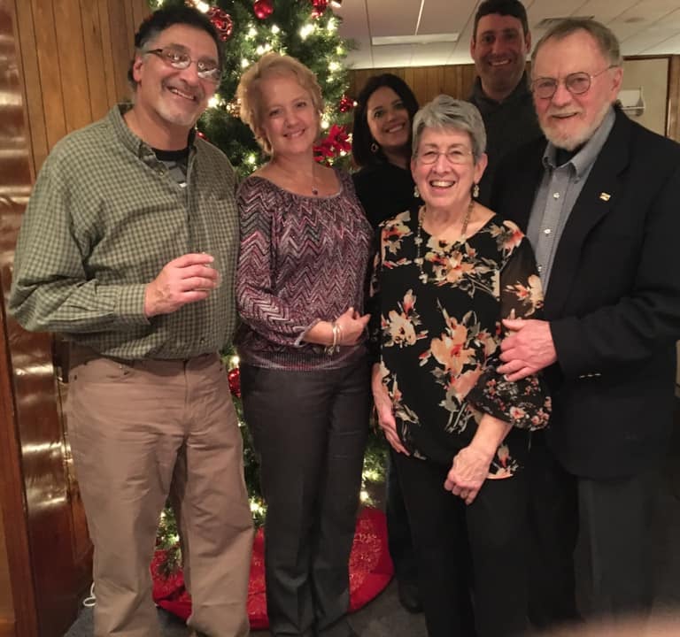 Smiling neighbors at the Crescent Hills holiday party