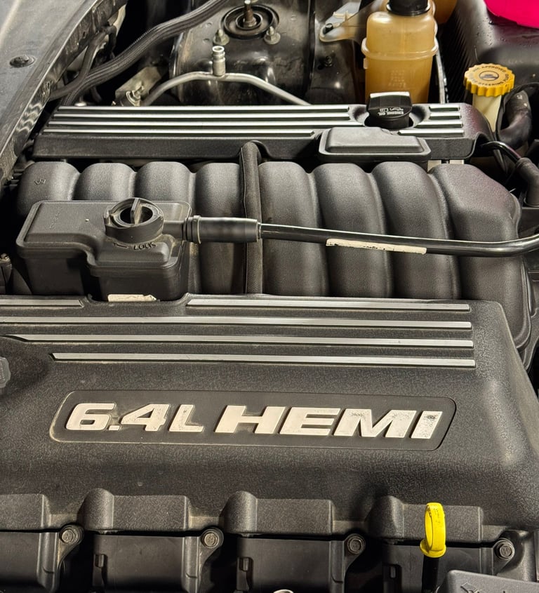 an Enlab car engine with a number of engine parts on it