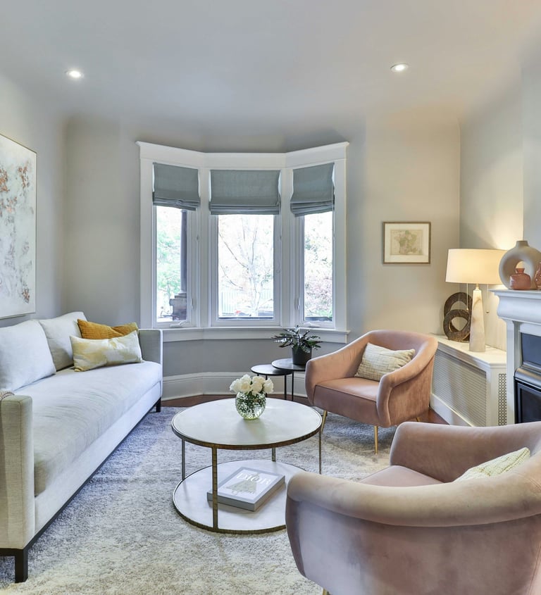 luxury pastel and white lounge room with bay window. Well lit..