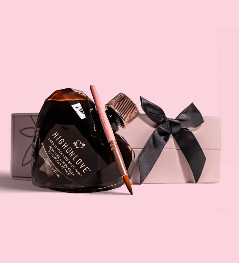 The photo shows a HighOnLove product  - a chocolate body paint, packaged in a crystal glass heart. 