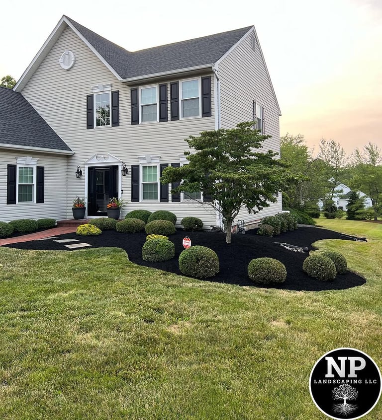 excellent landscaping and hardscaping of grass, stones and trees by NP Landscaping