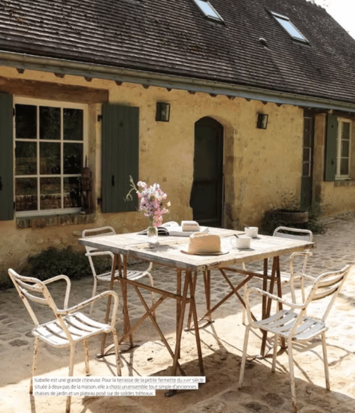 a table with a table set up outside, French countryside, normandy, cottage