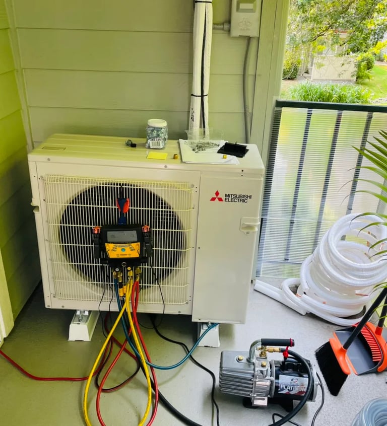 Engineer doing annual maintenance checks and readings on an Ac System on a balcony