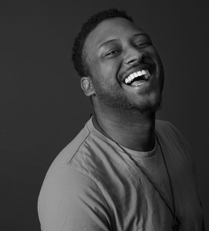 edwin bodney LA based spoken word poet laughs in black and white photo