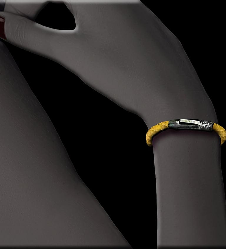 Handmade yellow fish leather bracelet worn on a wrist.