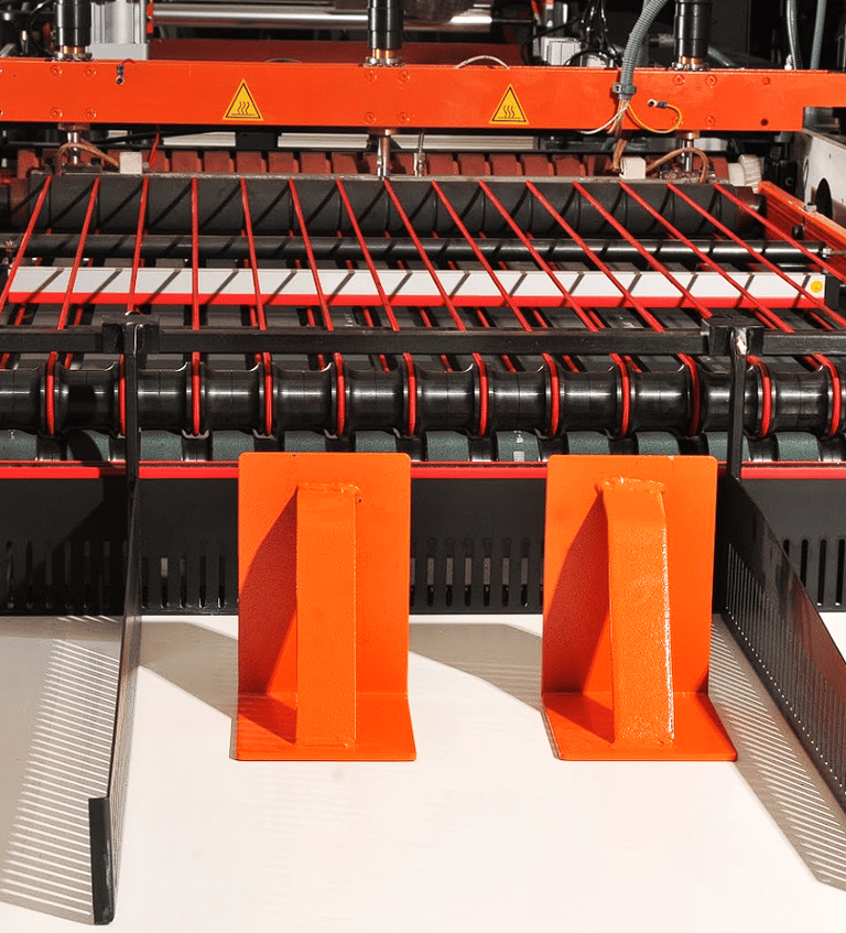a machine that is cutting into a sheet of paper