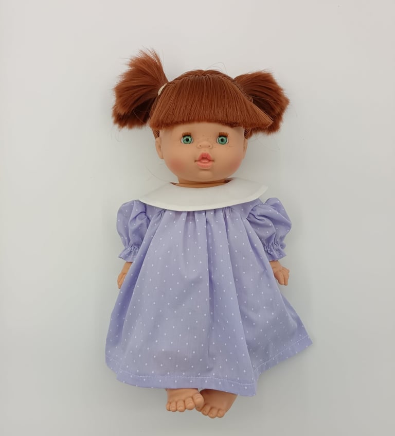 Minikane doll dressed in lilac handmade dress