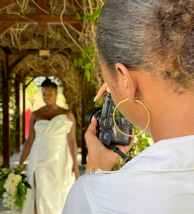 a woman in a wedding dress is taking a picture of a bride