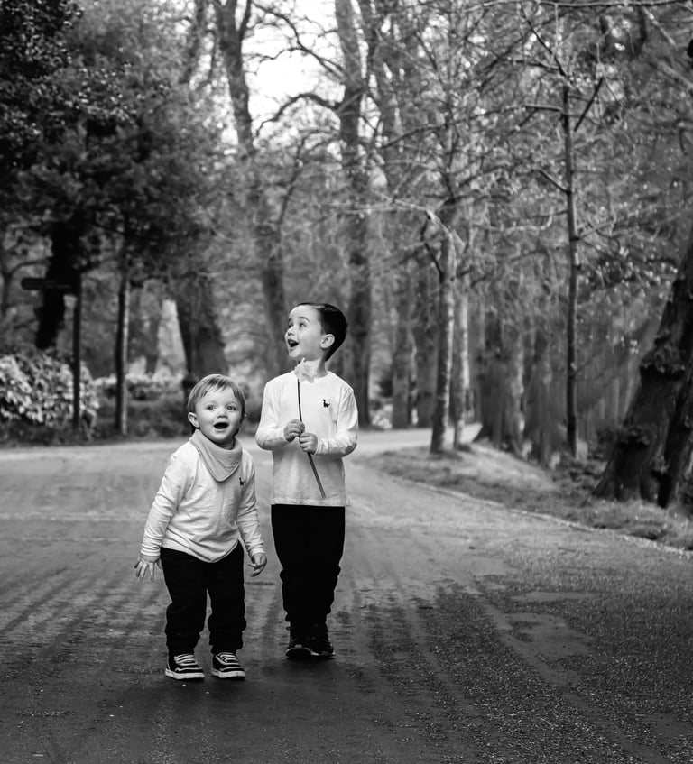 a woman and her son walking down a path