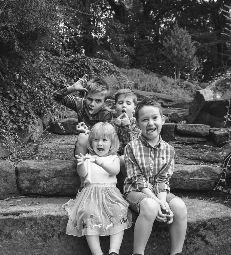 a group of children sitting on some steps