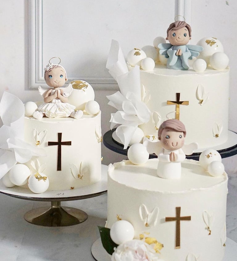 a couple of cakes with angels on them