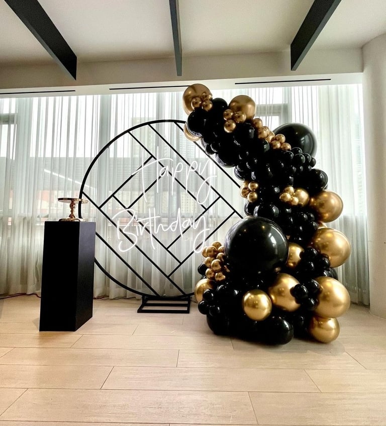 Black and gold balloon backdrop rental