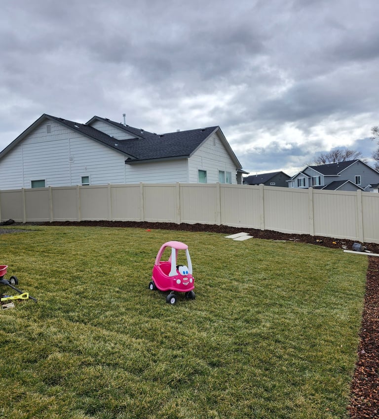Sloping vinyl tan fence