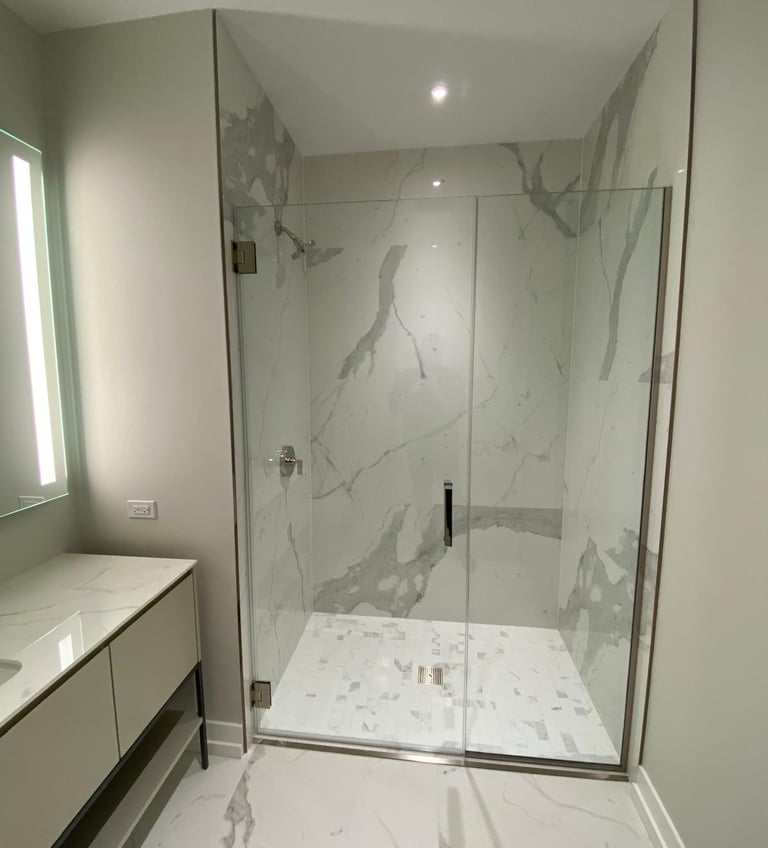 Modern bathroom remodeling project with custom walk‑in shower and tile installation in Highland Park