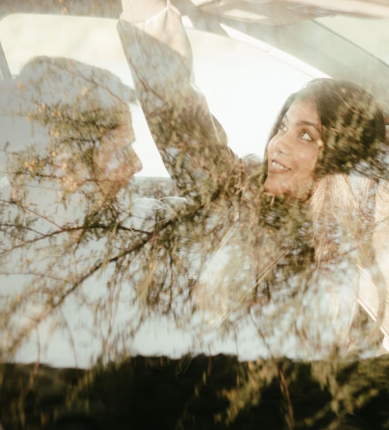 a woman in a car looking happy