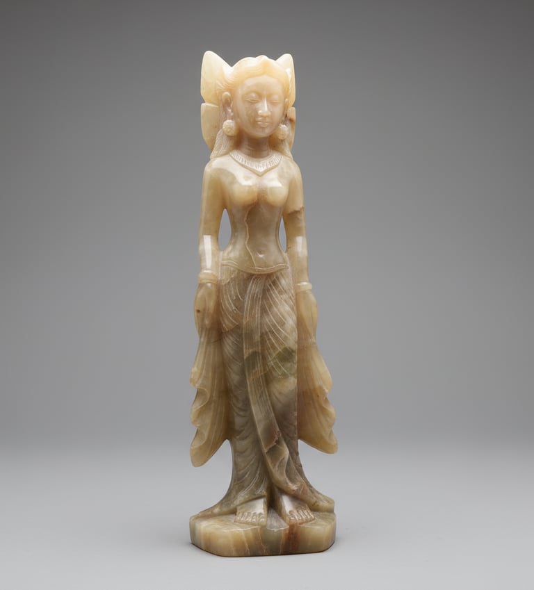 Elegant onyx stone sculpture of a serene female deity figure, semi-translucent with warm amber tones