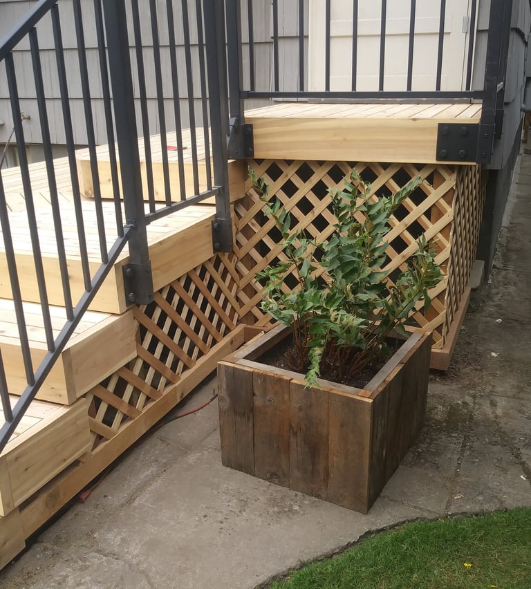 Cedar deck with a metal Handrail from Fortress Rails