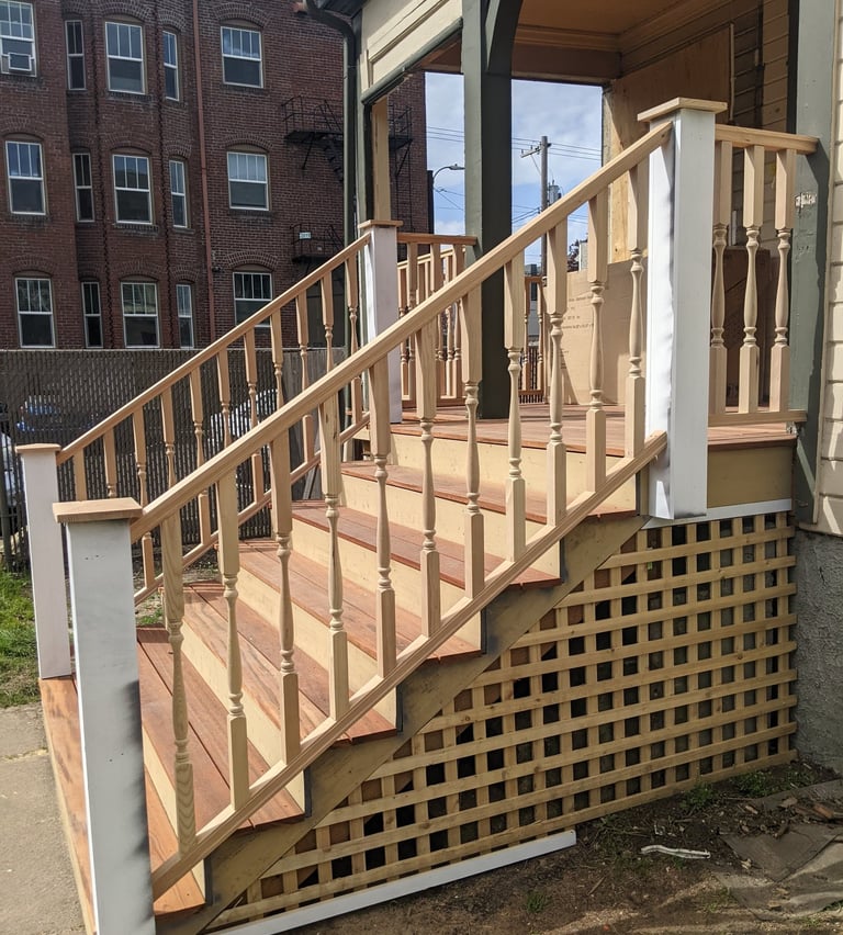 Front porch made from Tiger Wood and traditional wood spindle handrail