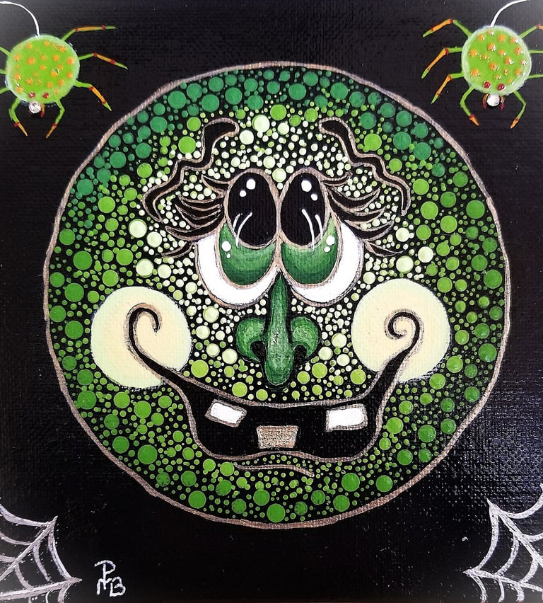 An emoji witch cartoon in bright greens with spiders and webs on the corners.