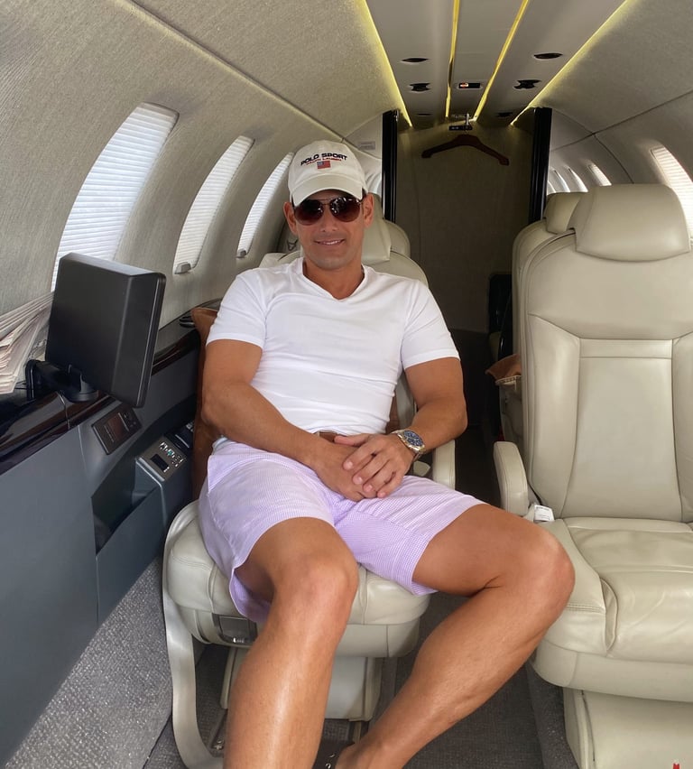 Rick Rockefeller-Silvia sitting in a private jet