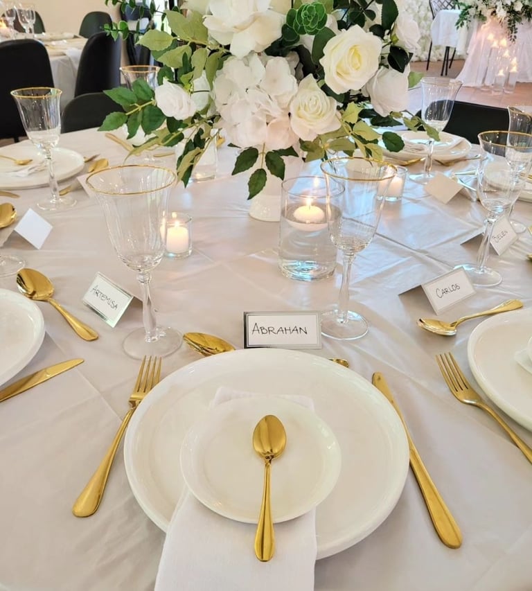 Gold Tableware with a floral centerpiece