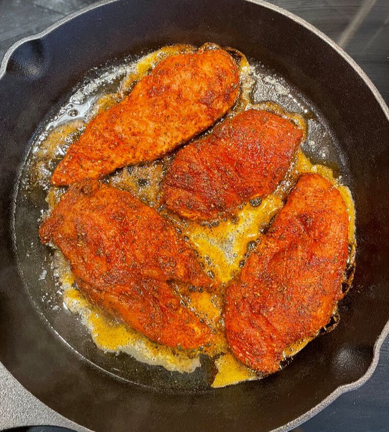 chicken with blackening spice cooking